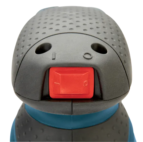 Red power switch with white on/off symbols, black and gray textured surface with dimples.