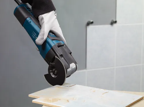 Bosch STARLOCK MAX power tool in use, cutting tile.
