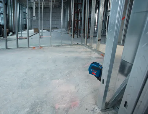 Bosch Professional GLL 50 laser level in a construction site.