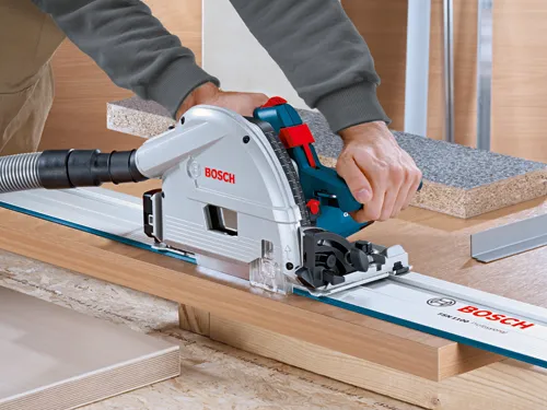 Bosch FSN 1100 Professional circular saw cutting wood, "BOSCH" visible.