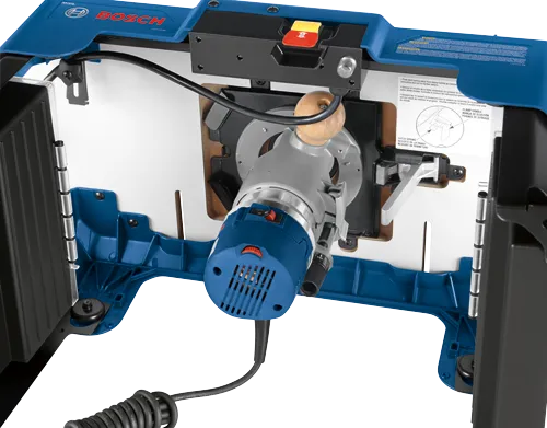 Bosch router table with router, with warning text and instructions.