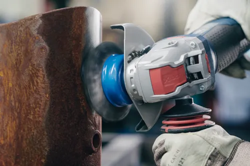 Grindng metal with a Bosch X-lock cup brush.