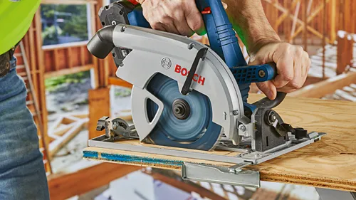 Bosch circular saw cutting wood, with visible "BOSCH" logo.