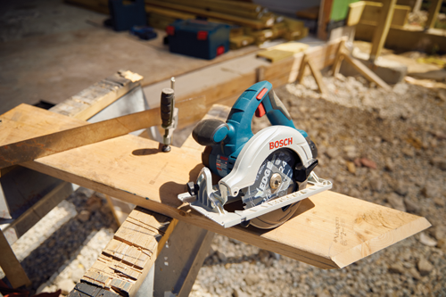 Bosch circular saw with visible "EDGE" blade on a wooden surface.