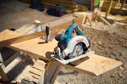 Bosch circular saw with visible "EDGE" blade on a wooden surface.