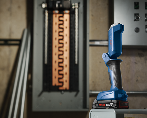Bosch cordless 18V flashlight illuminating a circuit breaker.