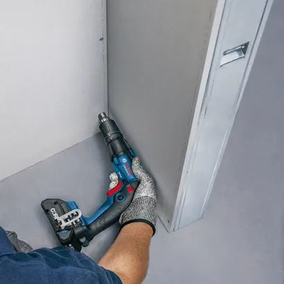 Bosch GTB18V-45 HD cordless screw gun being used on a drywall construction.