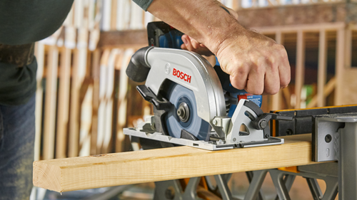 Bosch circular saw cutting wood; the word "BOSCH" is visible.