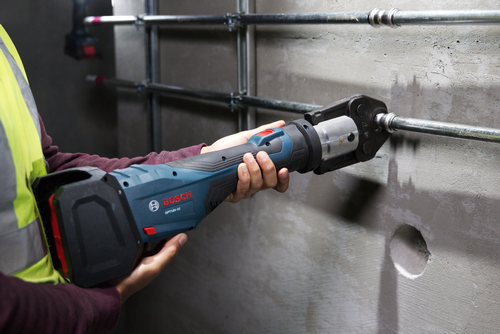 Bosch GPT18V-32 tool held by person, crimping a metal pipe.