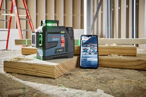 Bosch GLL330-42CG Professional green laser level projecting green lines, with a smartphone displaying "Leveling Remote".