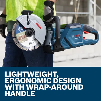 Bosch GCS18V-230 circular saw with "Concrete", "Brick", and "Stone" blade, held by a person wearing gloves. Visible text: "LIGHTWEIGHT, ERGONOMIC DESIGN WITH WRAP-AROUND HANDLE".