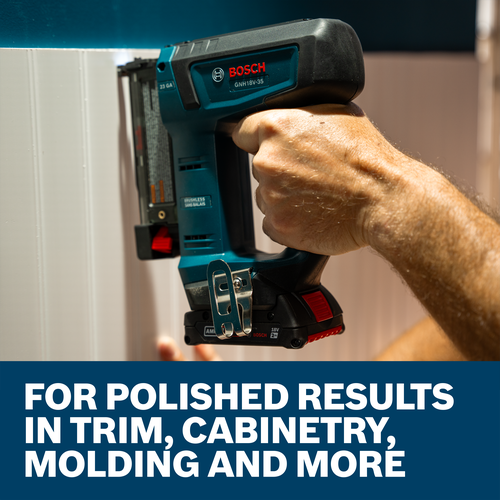 A worker using the Bosch GNH18V-35 23-Gauge Pin Nailer to install shiplap on a wall.