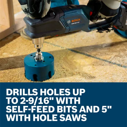 A worker using a Bosch GRD18V-127 18V High Torque Right Angle Drill to drill a hole in a wood floor with a hole saw.