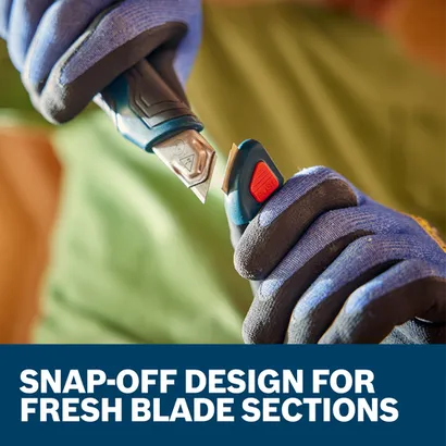 A worker snapping off a blade from the Bosch H11-12100-1 18mm Snap-Off Utility Knife.