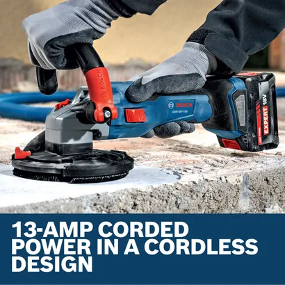 Image of worker using the Bosch GBR18V-15SN18X 5 In. 18V Concrete Surface Grinder on the concrete floor.