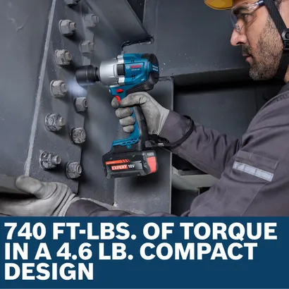 Image of worker using the Bosch GDS18V-780N 18V Brushless Mid-Torque Impact Wrench to to tighten screws.