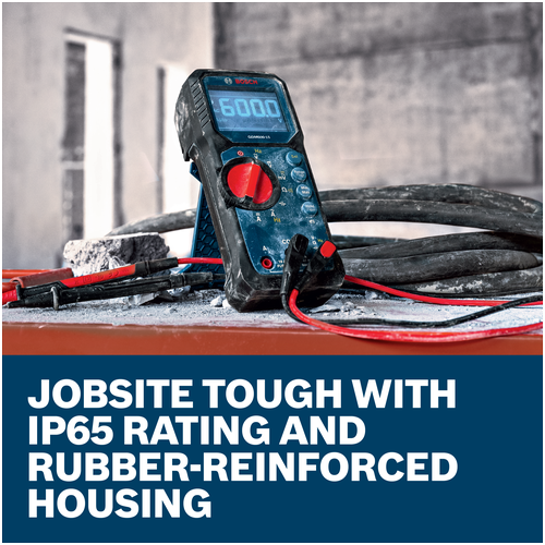 Bosch GDM600-15 True RMS Digital Multimeter on a dusty jobsite surface, advertising IP65-rated, rubber-reinforced housing.