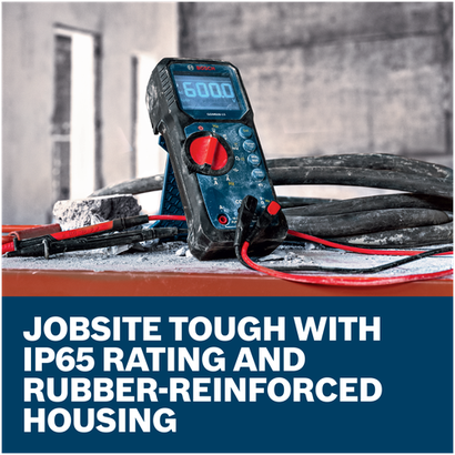 Bosch GDM600-15 True RMS Digital Multimeter on a dusty jobsite surface, advertising IP65-rated, rubber-reinforced housing.