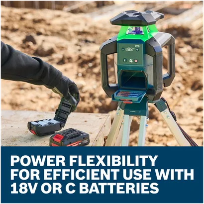 Bosch GRL18V-34K rotary laser level on tripod with user getting ready to insert 18V or C batteries.