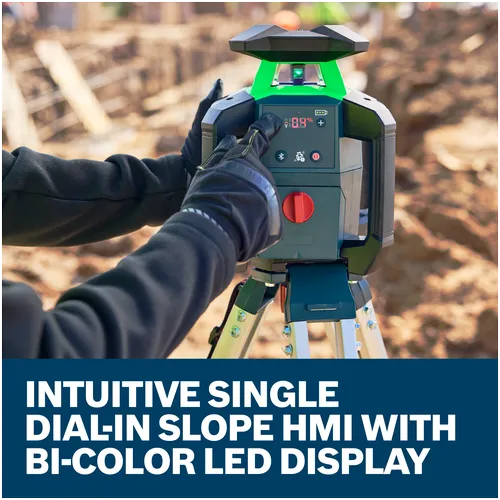 A worker dialing in single slope on Bosch GRL18V-34P 18V Green-Beam Horizontal/Vertical Rotary Laser on an exterior jobsite.