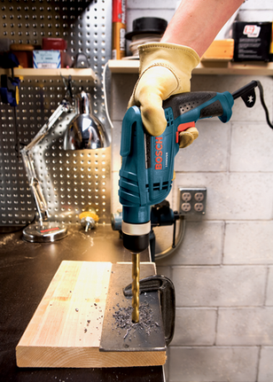 Bosch 1006VSR drill drilling into metal sheet.