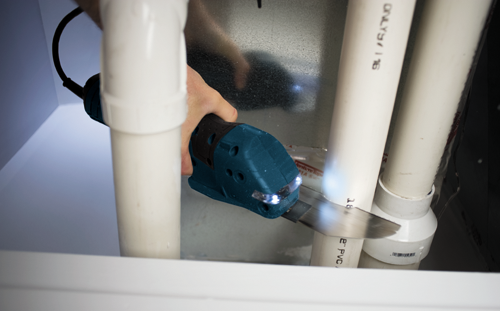 Bosch cordless handsaw cutting pvc pipe.