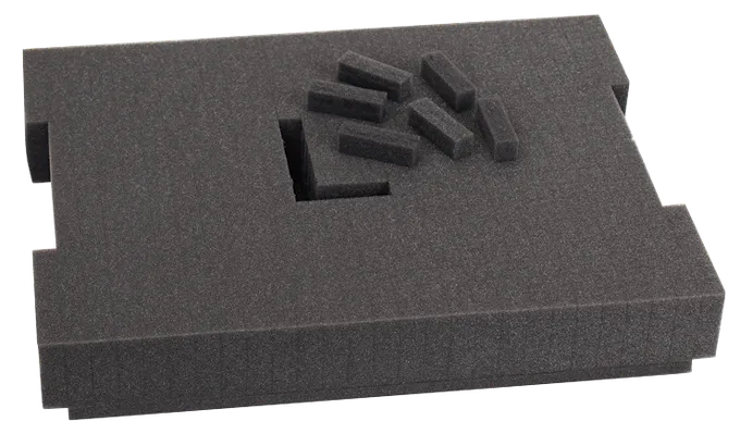 Dark gray foam insert with cutouts and small rectangular foam pieces.