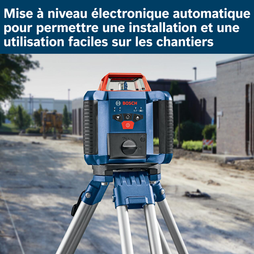 Niveau laser autonivelant électronique Bosch, avec commandes visibles et trépied, sur un chantier.