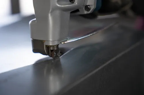 Close-up image of the blade of GSC18V-16E 18V 16-Gauge Metal Shear with Lock- On Slide Switch to cutting a metal.