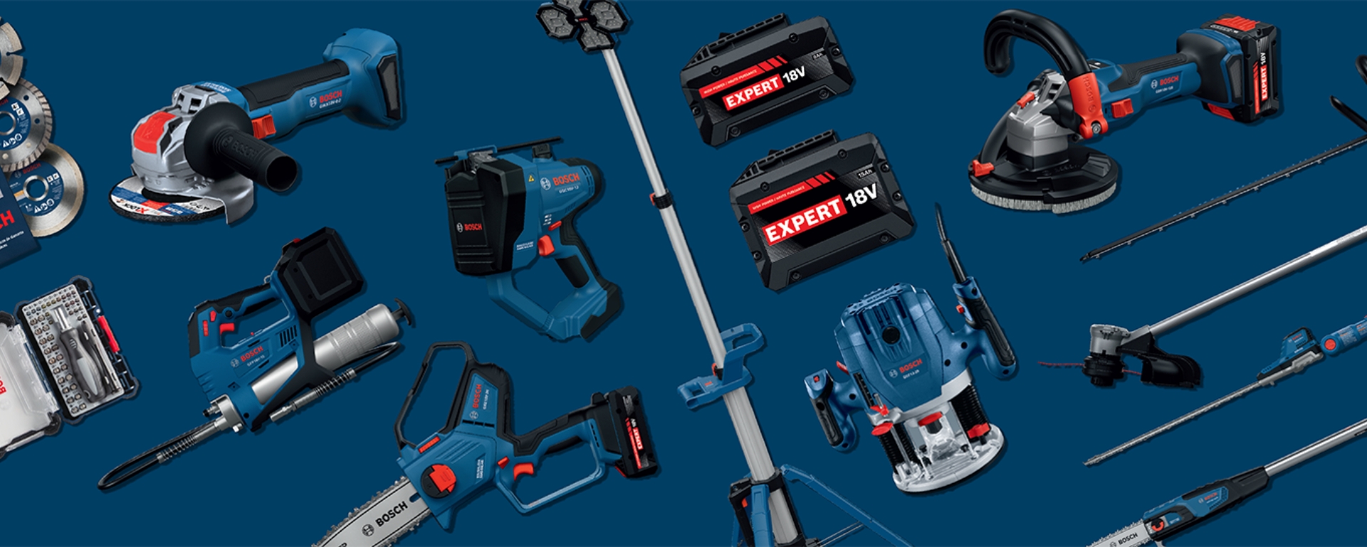 A collection of Bosch Professional tools displayed on a dark blue background, including a grinder, drill, and various batteries.