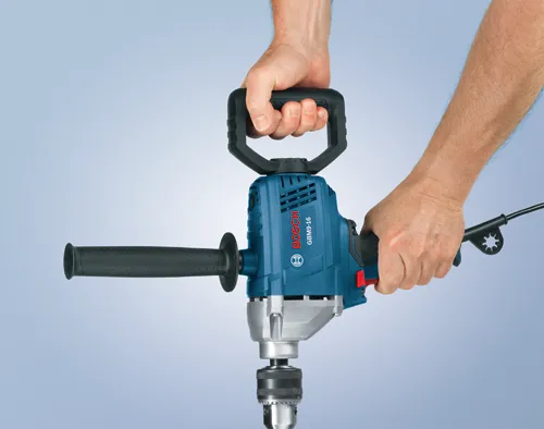 Bosch GBM9-16 drill held by two hands.