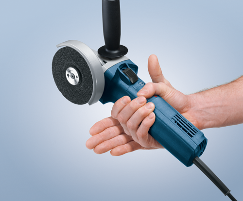 Bosch angle grinder being held by a person.