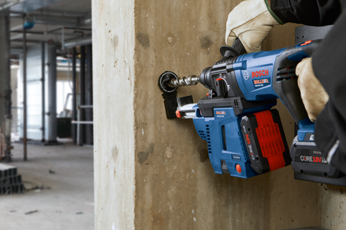 Bosch BULLDAG GBH18V-26D cordless hammer drill drilling into concrete, model GDE18V-26D, with CORE 18V battery.