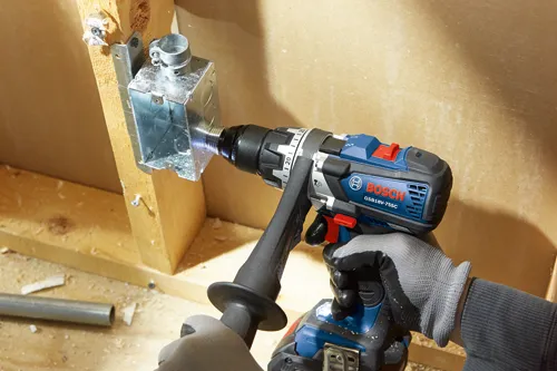 Bosch GSB18V-755C drill being used to install an electrical box.