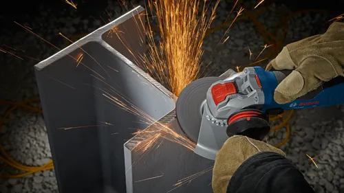 Bosch angle grinder cutting metal, sparks visible, hands wearing gloves, X-LOCK is visible on the tool.