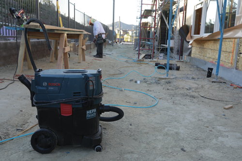 Bosch VAC090A HEPA Ready vacuum cleaner on a construction site.