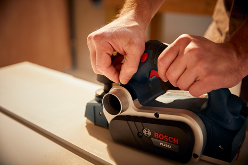 Bosch PL2632 electric planer in use.