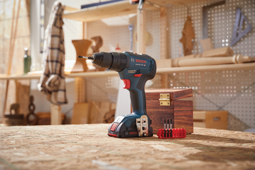Bosch GSB18V-490 HD cordless drill with a set of bits and accessories.
