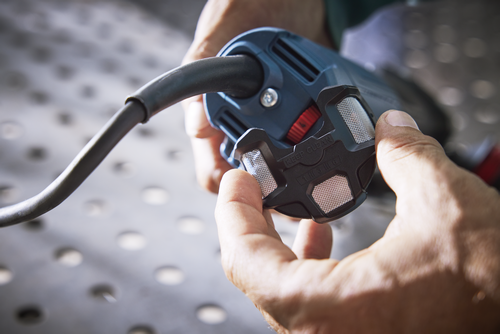 Human hands holding a black device, visible text reads "KEEP CLEAN", "1 III 3 III 6".