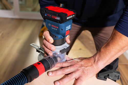Bosch cordless palm router GKF18V-25 model application image on wood working.