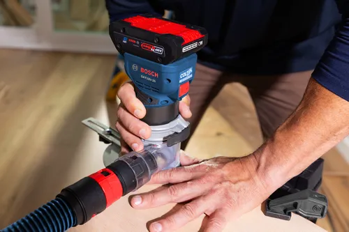 Bosch cordless palm router GKF18V-25 model application image on wood working.