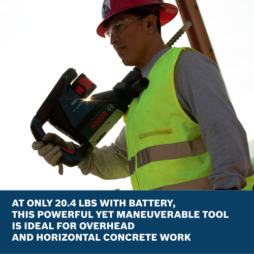 A worker holding a Bosch GBH18V-45L 18V SDS-max® 1-7/8 In. Rotary Hammer ideal for overhead and horizontal concrete work.