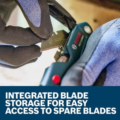 A worker holding and handling the blade of the H11-11100-1 folding utilty knife.