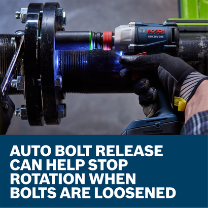 A worker loosening a bolt from a metal fitting with the Bosch GDX18V-285 18V Two-In-One Bit/Socket Impact Driver/Wrench.