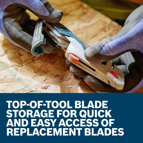 A worker handling the Bosch Retractable Utility Knife H11-13000-1 to change the blade.