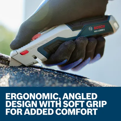 A worker using the Bosch Retractable Utility Knife H11-13000-1 a soft material.