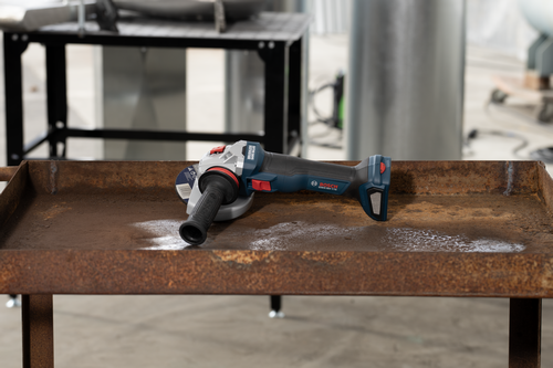 Bosch GWS18V-11S Brushless 4-1/2 – 5 In. Angle Grinder with Slide Switch and without battery on a iron table.