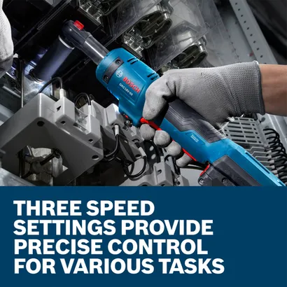 The worker using the Bosch GRC18V-60N 18V Cordless Ratchet to tighten screws on machinery.