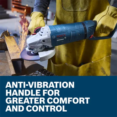 The worker using the Bosch GWS25-180PR 7 In. Large Angle Grinder to grind the edge of a piece of metal in a work shop.