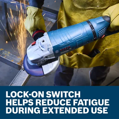 The worker using the Bosch GWS25-180PR 7 In. Large Angle Grinder to grind the edge of a piece of metal in a work shop.